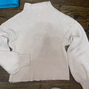 Light pink turtleneck with small pearls on it. Soft & comfy